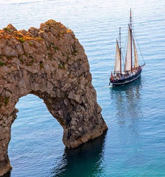 Moonfleet sailing off Durdle Door 