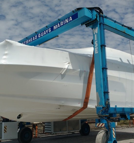 New boat wrapped on hoist at Portishead marina 