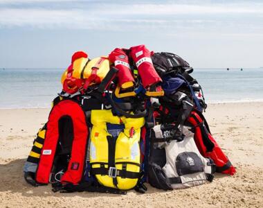 37577 variety of lifejackets piled on a beach nathan williams 16x9 