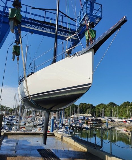 sitting pretty   boat in crane 